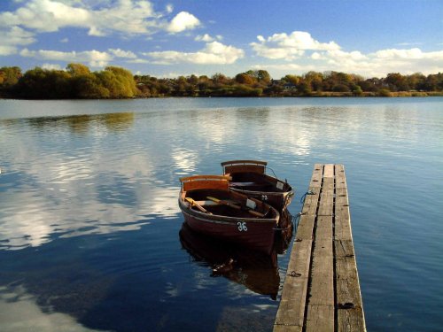 Hornsea Mere reflecting summer clouds