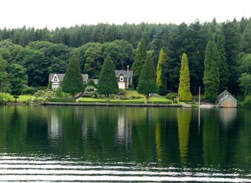 Windermere shore as seen from pleasure craft.