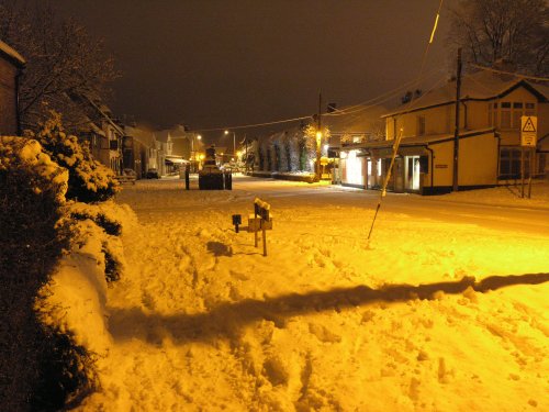 Late evening February 2009 the snowy High Street, bathed in the orange light of the street lamps