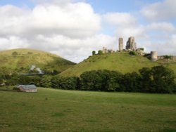 Swanage Railway Steam train approaching Corfe Castle.