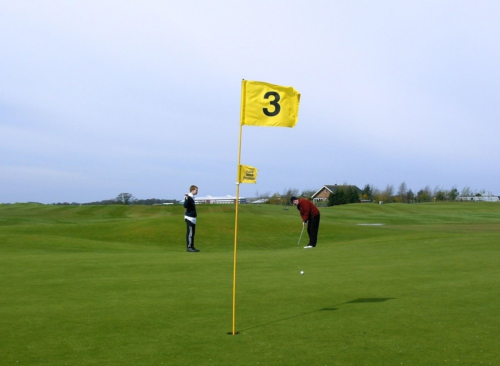 My Son Thom with his Grandad Alan on the 3rd green at Adlington Golf Course