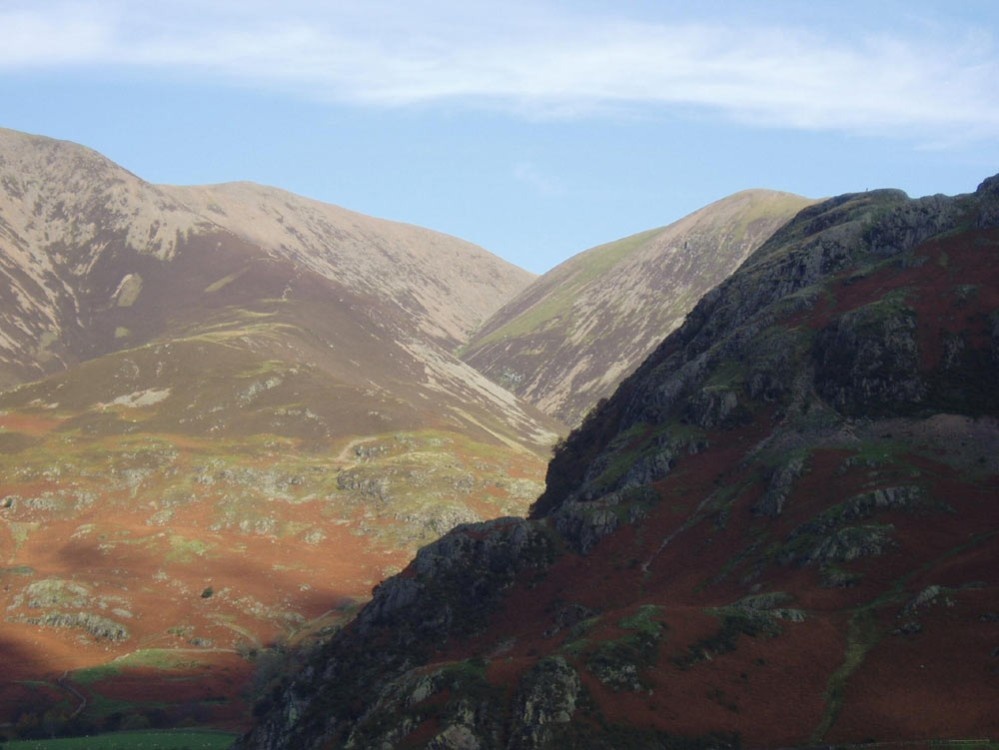 Looking from the opposite side of Crummock water and Low fell runs between the two mountains