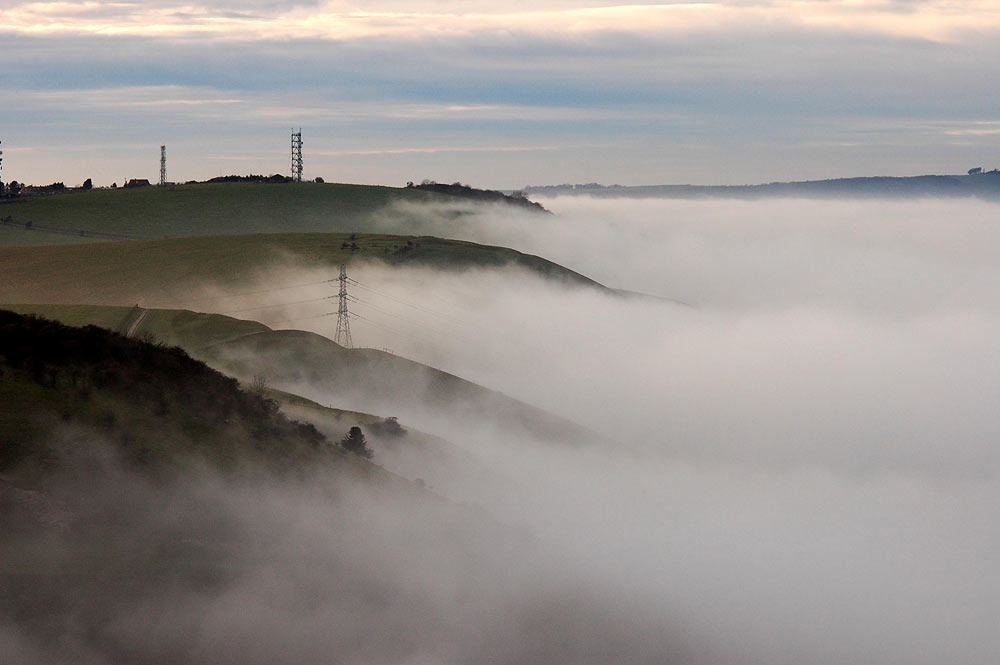 Photograph of Fog rolls over the South Downs on the Fulking Escarpment, West Sussex