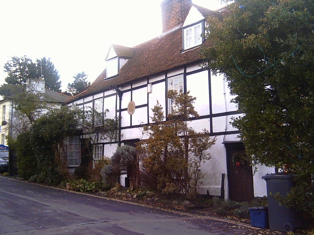 Photograph of Hullbridge, Essex. Cottages built 1793 near the river