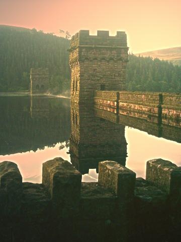 Sunrise over the Howden Dam in The Derwent Valley. Derbyshire August 05