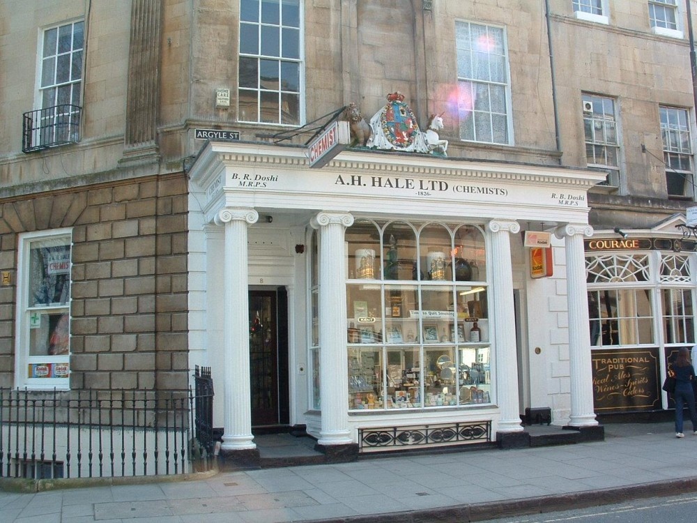 Apothecary shop Est. 1826, royal warrant sits atop portico.  Bath, AVON