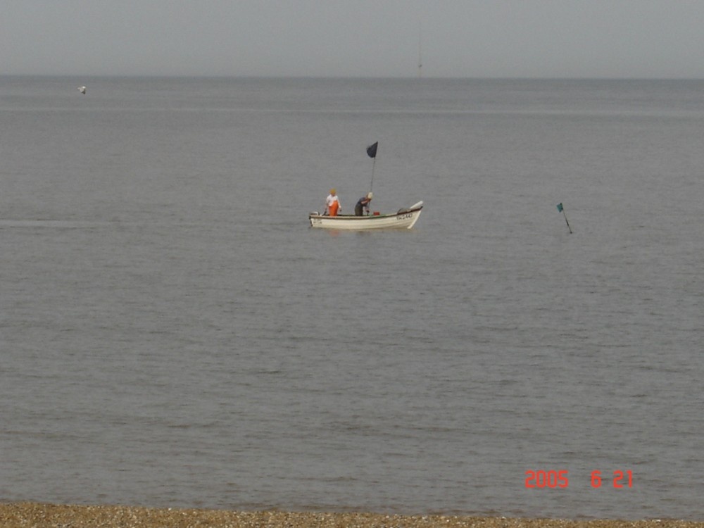 fishmen in sea at Caister, Norfolk.