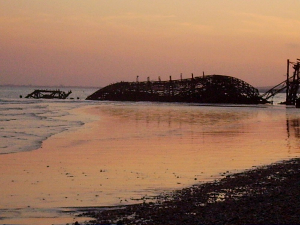 The old pier, Brighton beach on a summers evening.