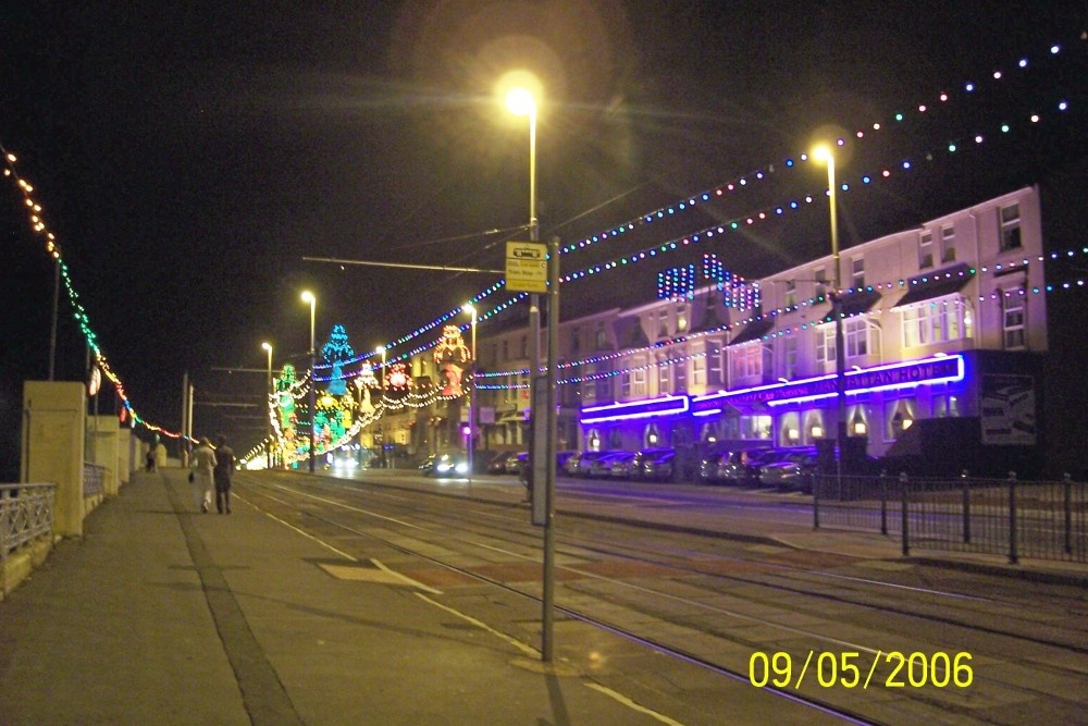 Long view of lights coming out of Blackpool, and start of nursery rhymes.