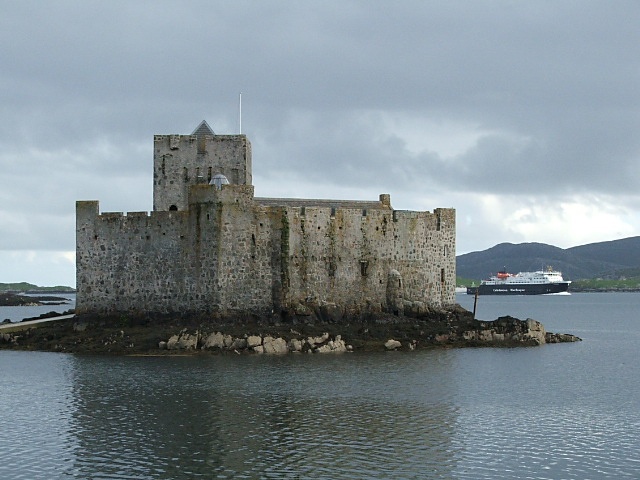 Photograph of Castle Kismul in Castlebay with incoming ferry in backround