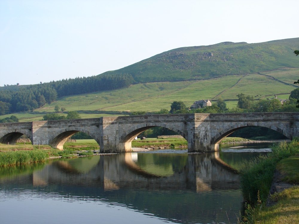 Burnsall bridge, shadows of bridge in the river Wharfe