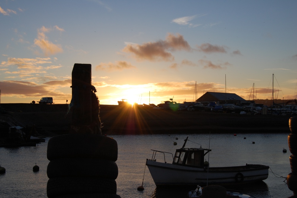 Photograph of Axmouth Harbour, Devon. Winter sunset.