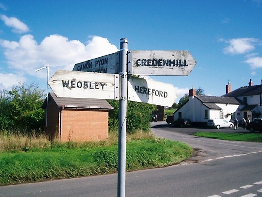 Photograph of Direction sign at Tillington crossroads on the former Turnpike Road from Hereford to Weobley.