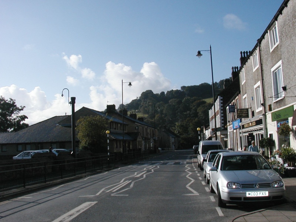 At end of main road through Whalley, Lancashire, with view of hill.