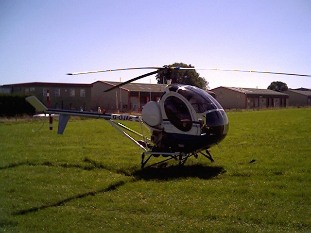 Small helicopter (a Hughes) at Dunkeswell, Devon