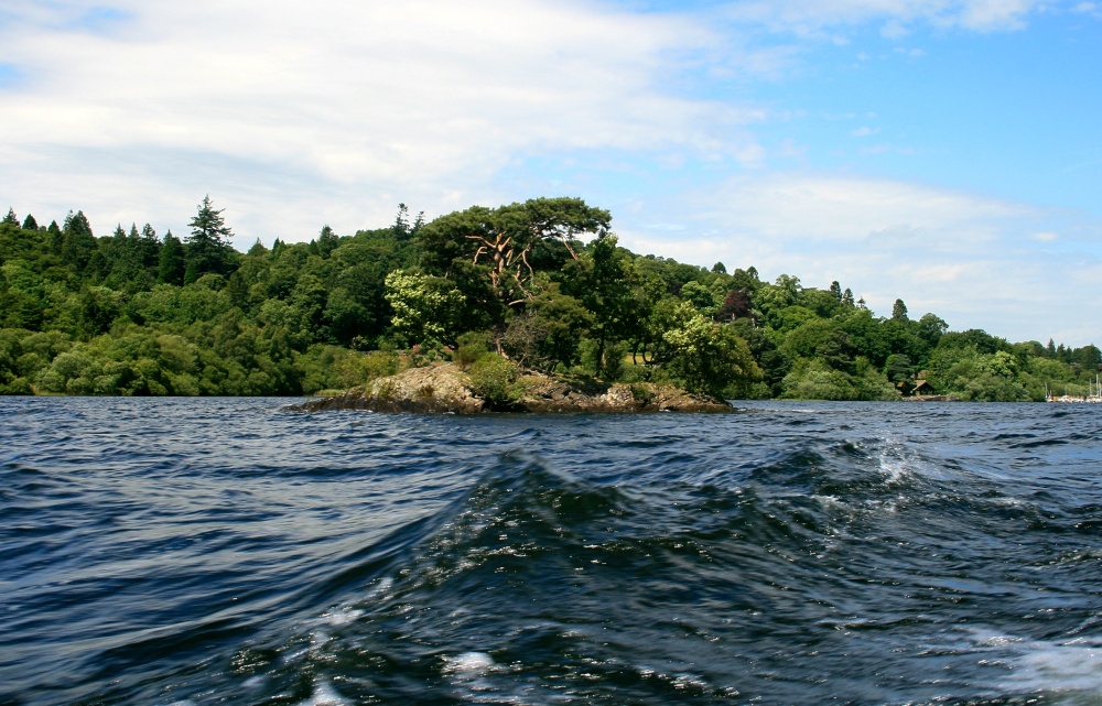 Derwentwater shore as seen from pleasure craft.