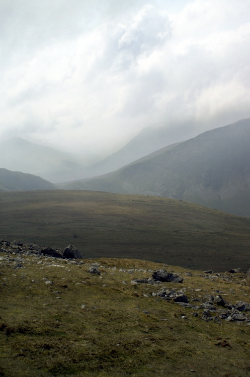 Distant cloud covered mountains.