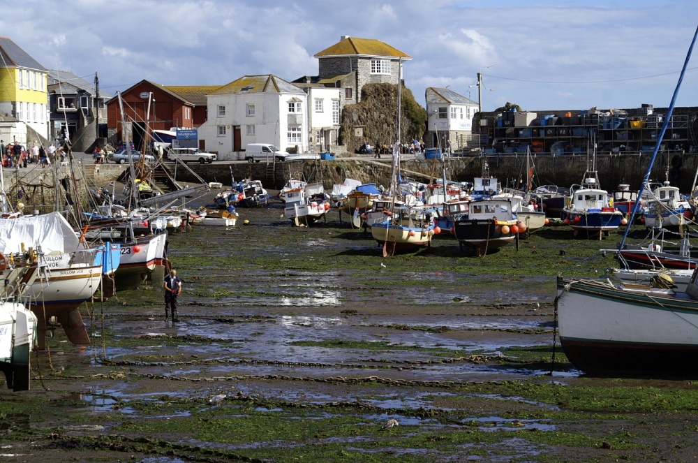 Mevagissey inner harbour when the tide is out.