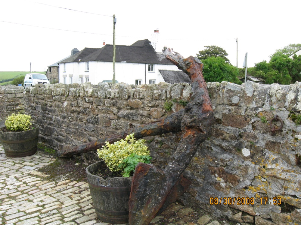 Photograph of An old anchor in the yard at Jamaica Inn