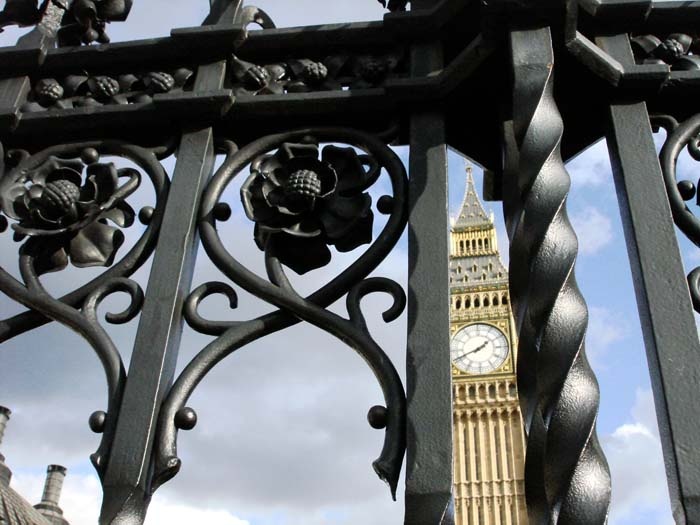 Big Ben through wrought iron at Westminster Abbey photo by Evey Pinkham