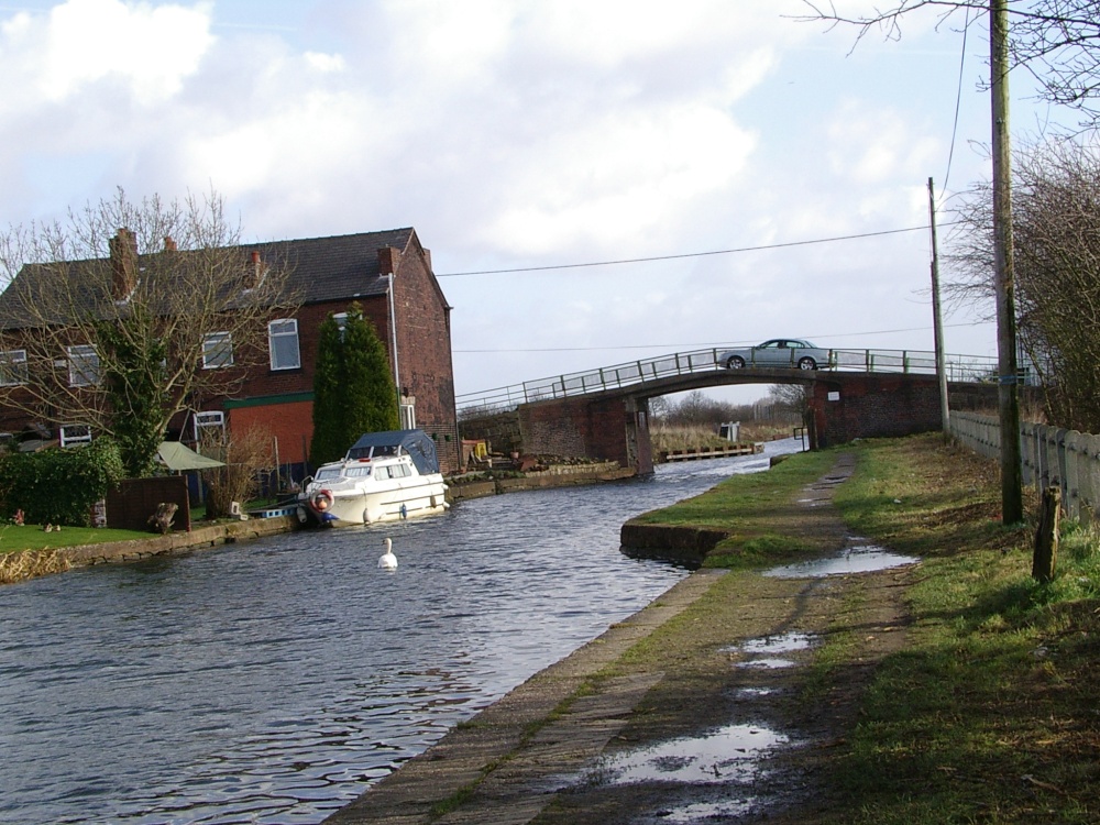 Photograph of Bridge over calm water