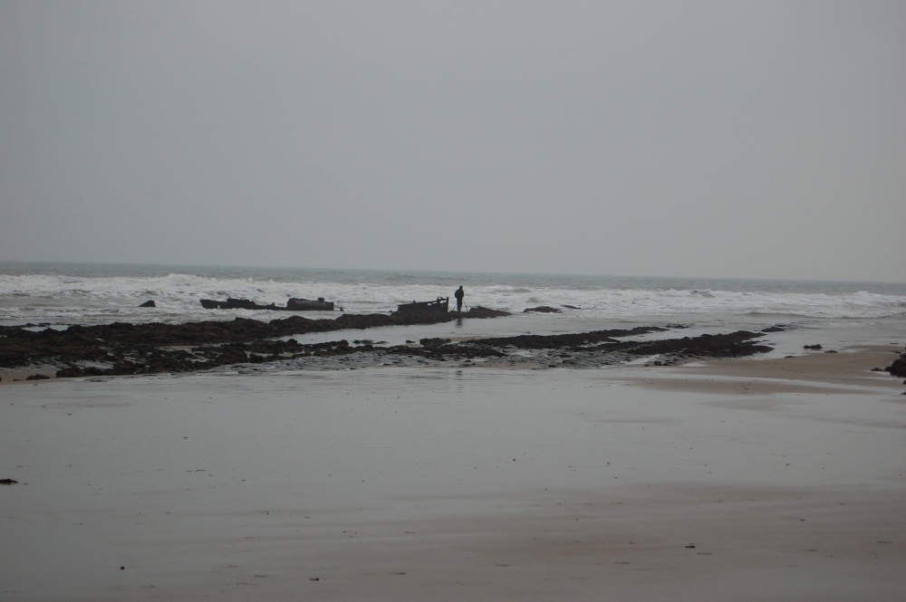 Fisherman and shipwreck