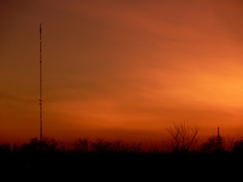 Sunset over TV mast.