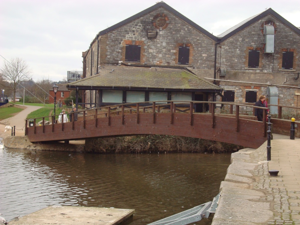 Wooden pedestrian bridge through the River Exe.