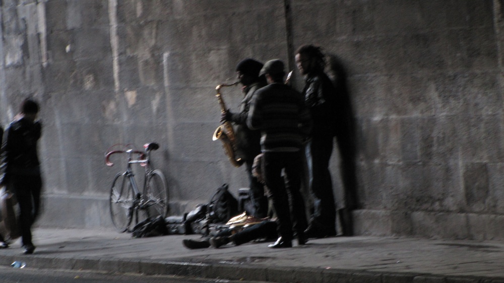 Buskers under a bridge in Edinburgh