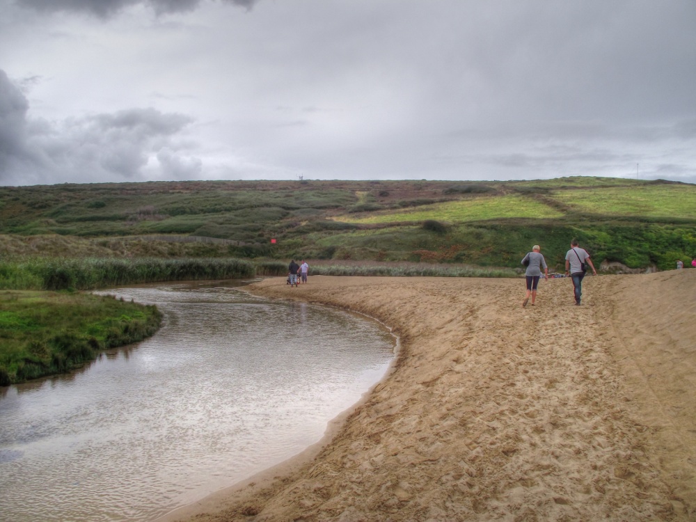 Photograph of The stream and beach at Holywell bay