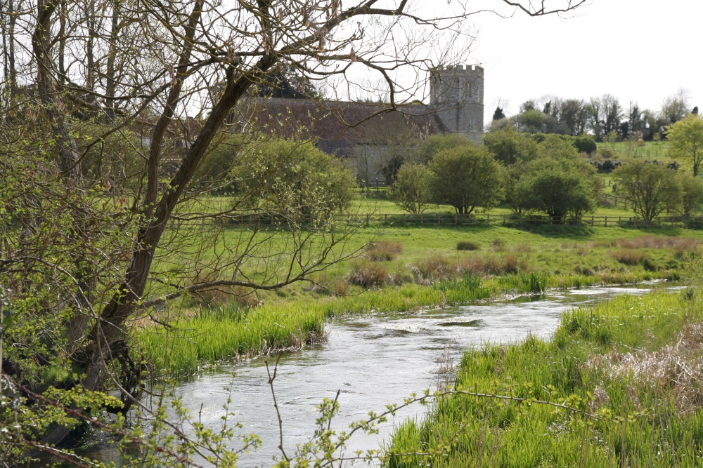 Photograph of The River Lambourn at  Great Shefford with St. Mary's Church in the background.