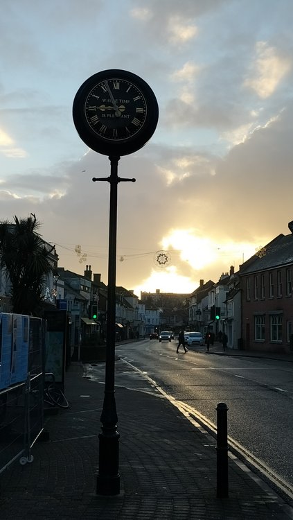 The clock in Christchurch High Street with picturesque sky behind