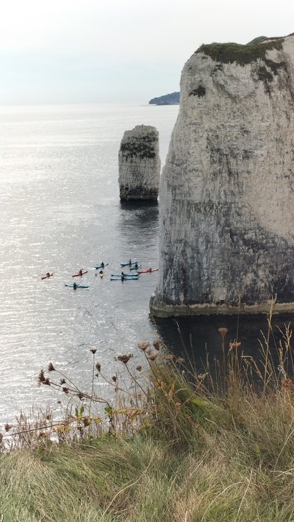 Canoeists beneath cliff edge near Studland village